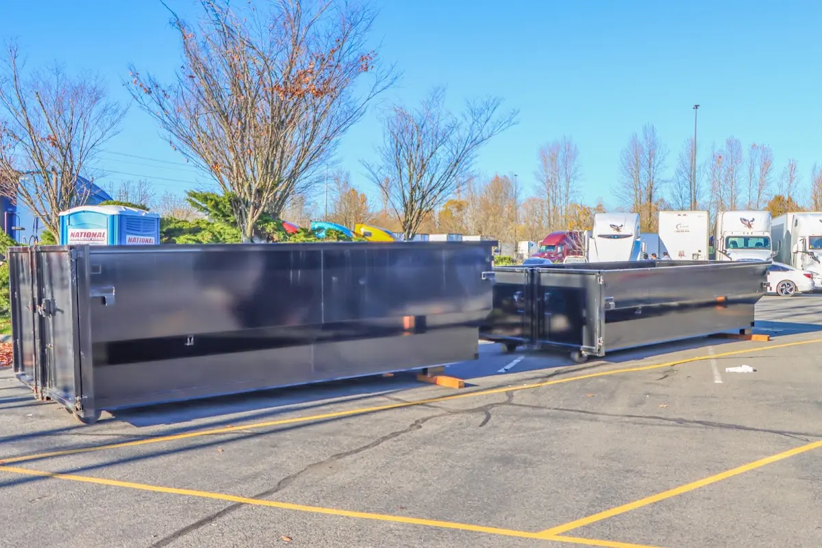 Professional dumpster rental service with roll-off container on residential driveway in Killeen